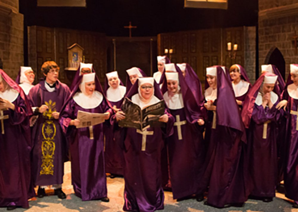 Purple Nuns costumes with white wimple's, vails, shoes and crosses for Sister Act the Musical.